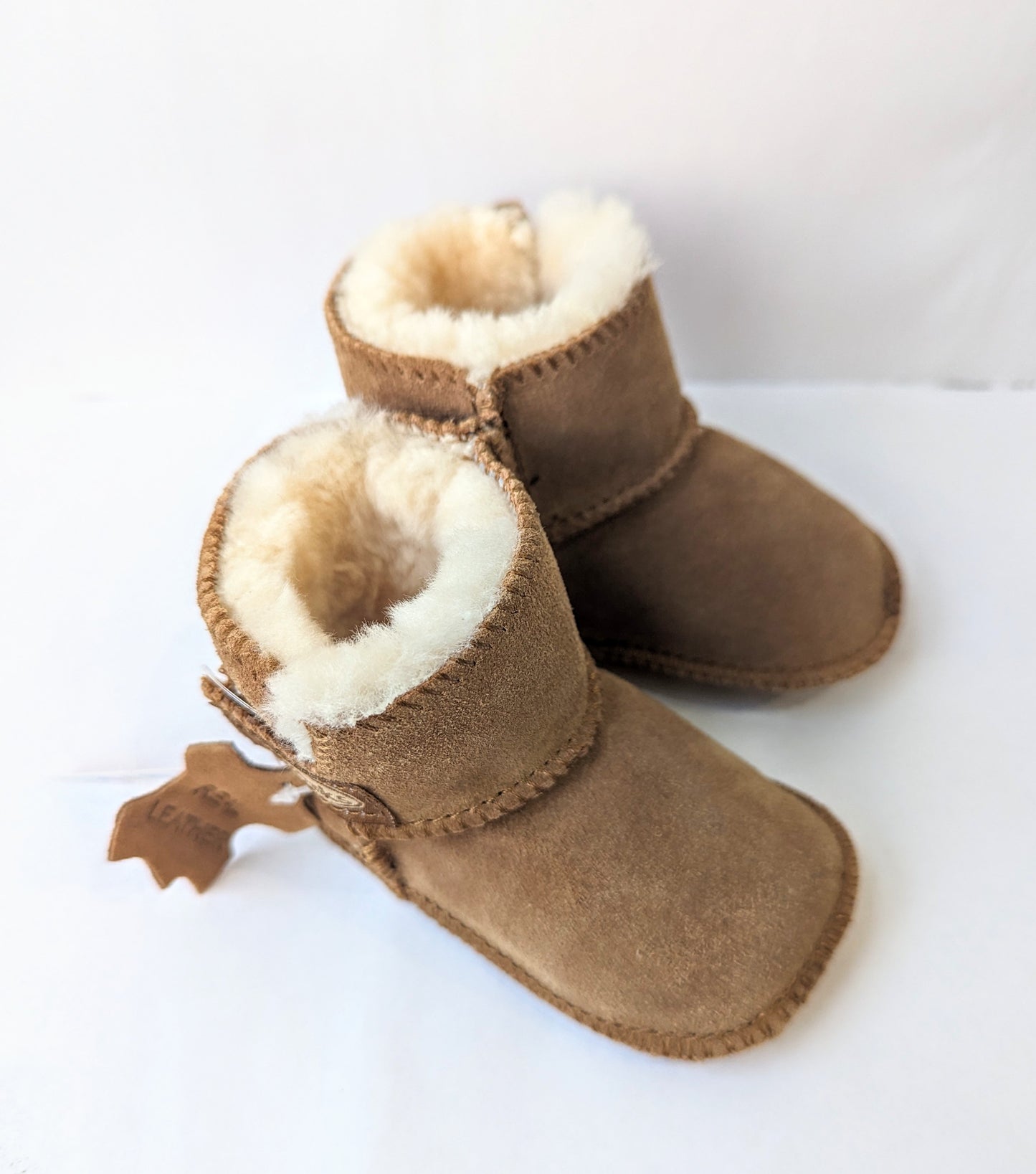   A pair of unisex pull on warm lined slipper boots by Chipmunks, style JoJo, in tan. View from above.