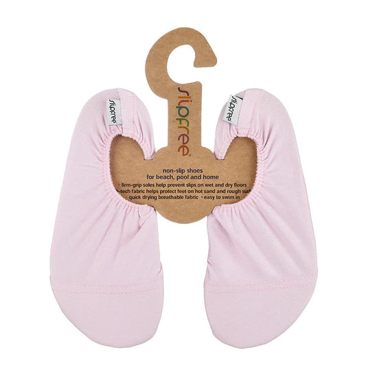 A pair of girls non-slip swim shoes by Slipfree, style Pale Pink, in pink. Front view. 