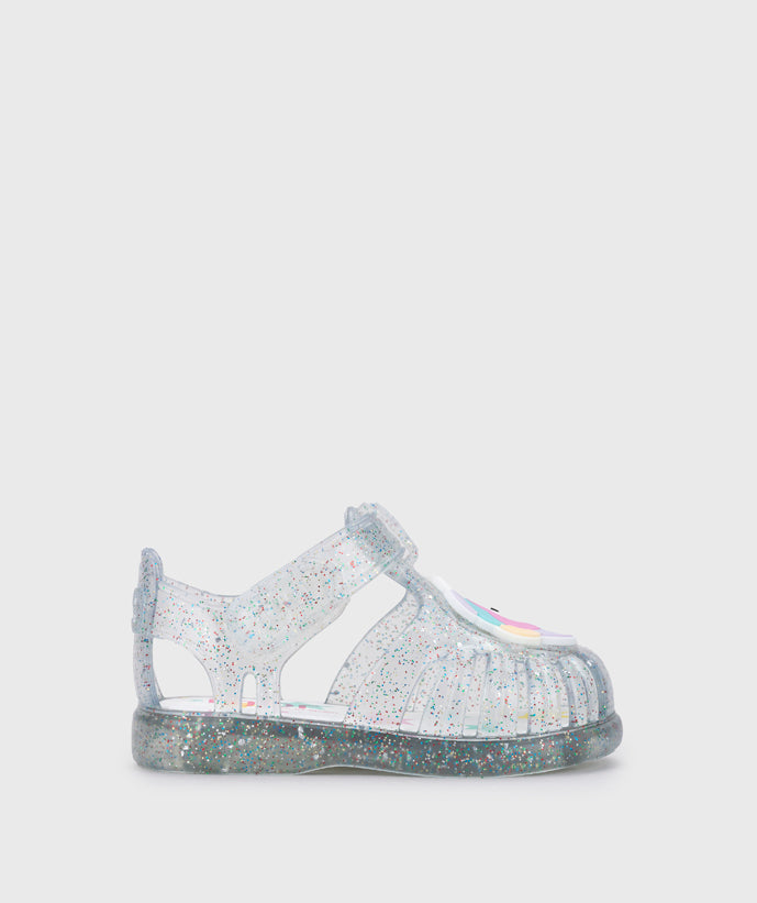 A girls jelly sandal by Igor, style Unicornio in transparent/multi/glitter with velcro strap and unicorn design on front. Right side view
