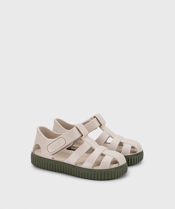 A unisex sandal by Igor, style Nico in khaki with velcro strap and dark green sole. Angled side view of pair