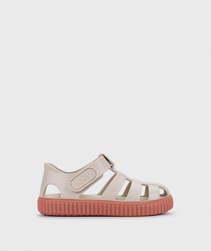A girls sandal by Igor, style Nico in sand/terracota with velcro strap and pink sole. Right side view