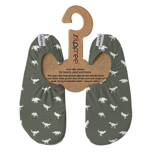 A boys non slip swim shoe by Slipfree, style Dino Green, in green with dinosaurs print. Front view.