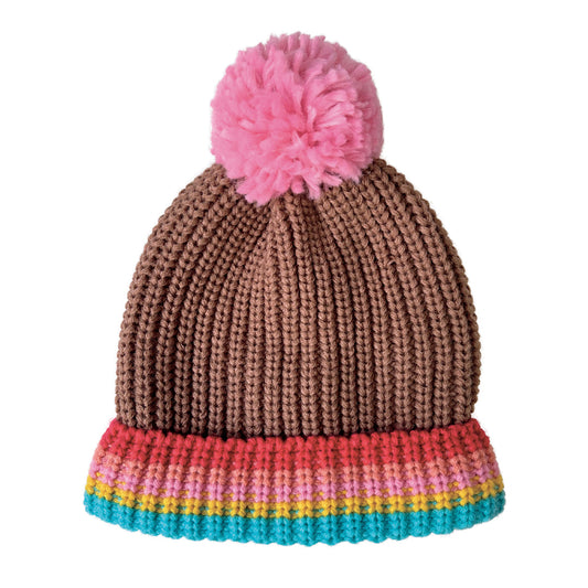 A knitted bobble hat by Rockahula, style Rainbow Stripe, in rainbow stripe and brown with pink bobble. Front view.