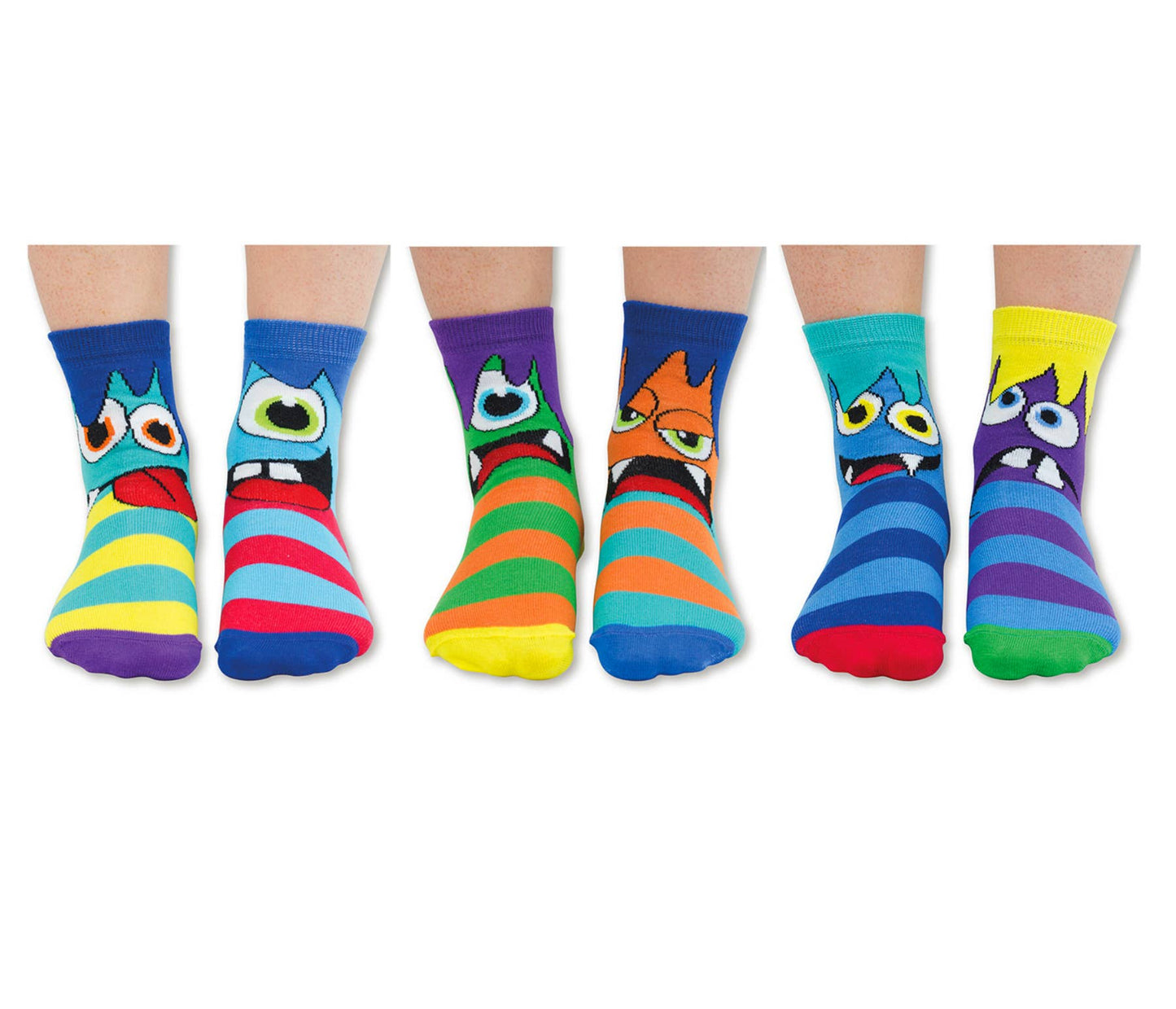 3 pairs of non matching multicoloured monster print socks by Odd Socks, style Mini Mashers. Front view of children wearing socks.
