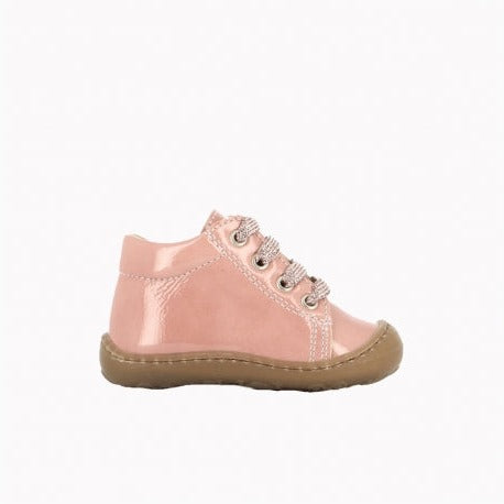 A girls ankle boot by Bopy, style Jordana, in pale pink patent with toe bumper and lace up fastening. Right side view.