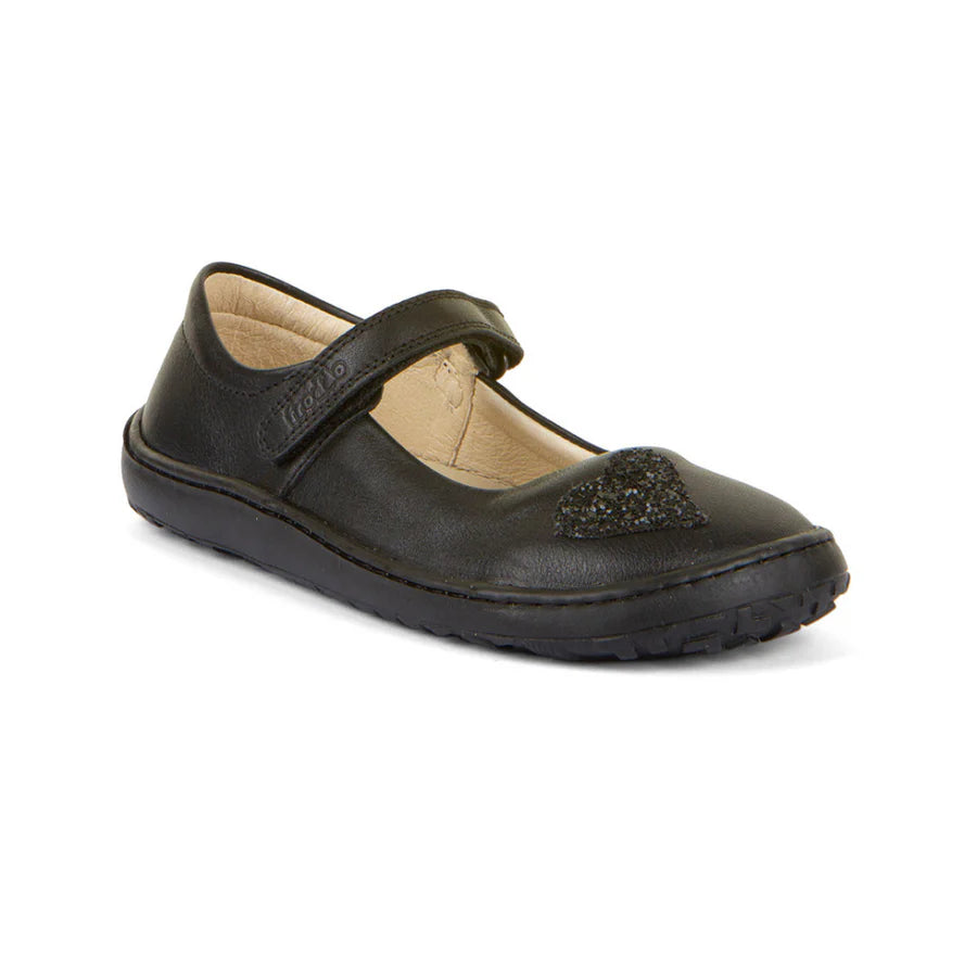 A girls Mary Jane  school shoe by Froddo, style Nina H 3140191, in black leather with glitter heart to front upper and velcro fastening. Angled right side view.
