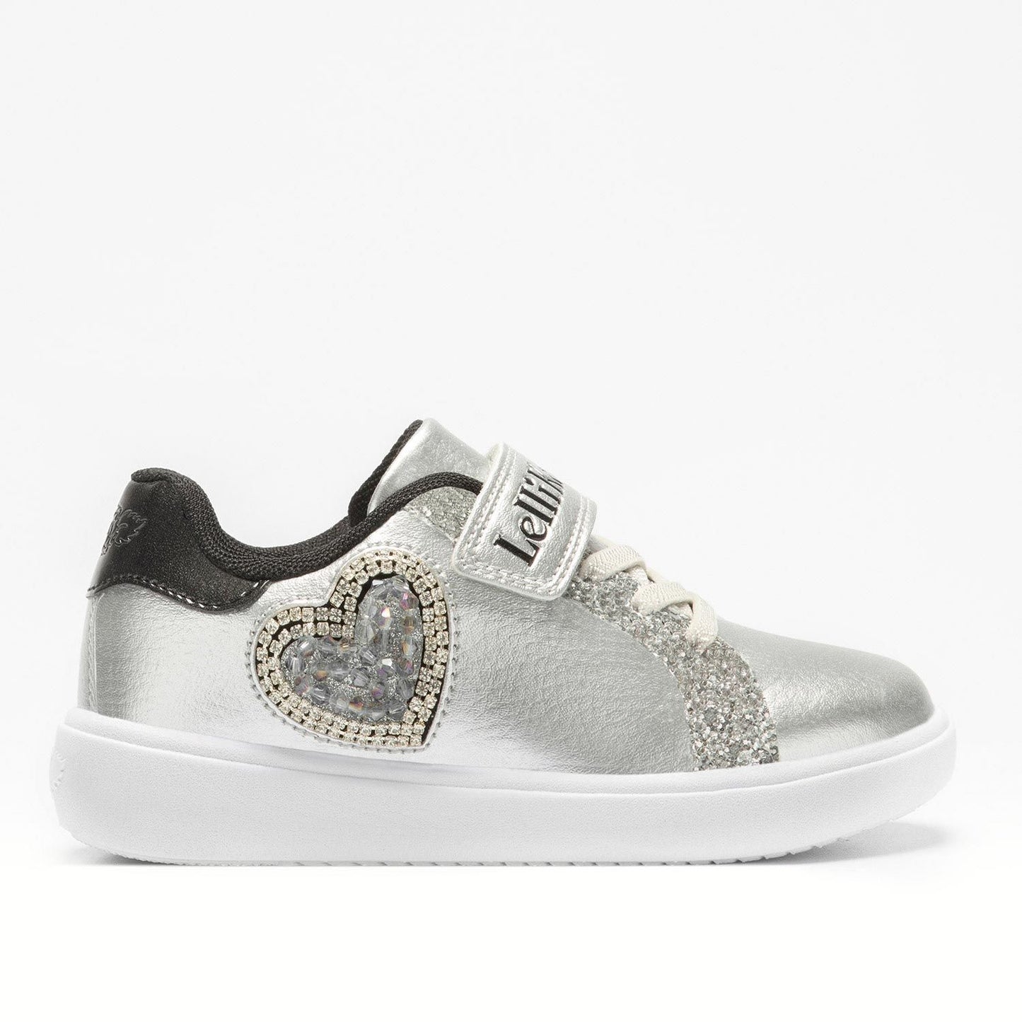 A girls trainer by Lelli Kelly, style LKAA3828, with embellished heart detail in silver and black with single velcro fastening. Right side view.