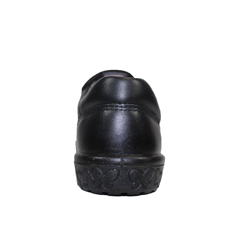 A girls t-bar school shoe by Ricosta, style Scarlett in black with velcro strap and star pattern on the front. Back view