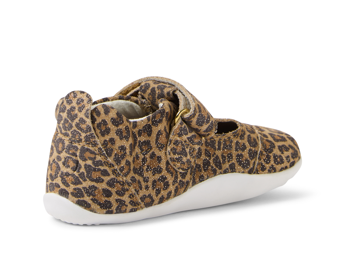 A girls T-Bar pre walker by Bobux, style XP Scout, in brown leopard print with velcro fastening. Angled left side view.