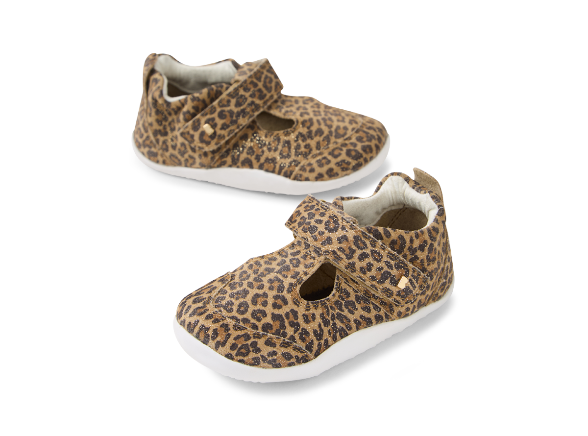 A girls T-Bar pre walker by Bobux, style XP Scout, in brown leopard print with velcro fastening. Angled view of a pair.