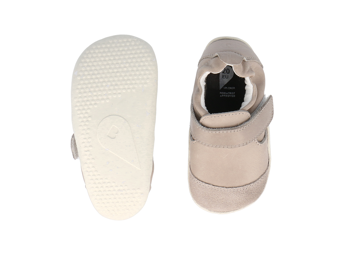 A unisex pre-walker by Bobux, style XP Marvel,in  taupe leather and suede with velcro strap.  Above view of pair showing sole and top of shoe.