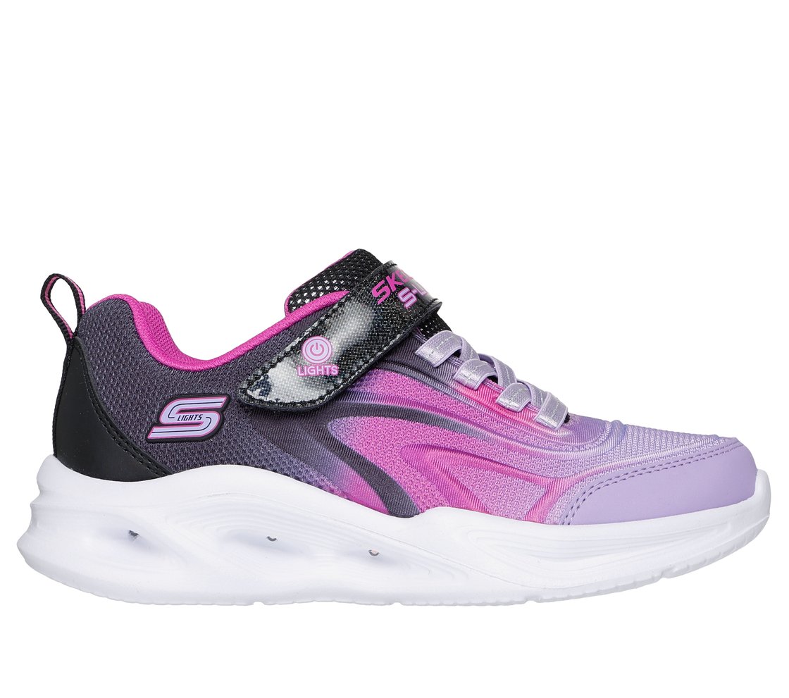 Pink and purple trainer with velcro strap and laces by Skechers. Side view