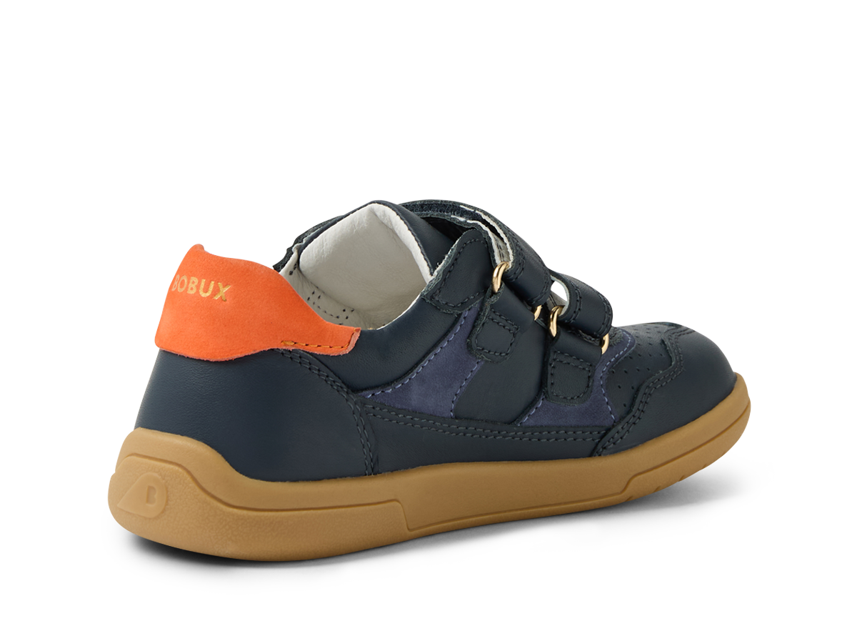 A boys casual shoe by Bobux , style Hunter, in blue and orange with double velcro fastening. Angled left side view.