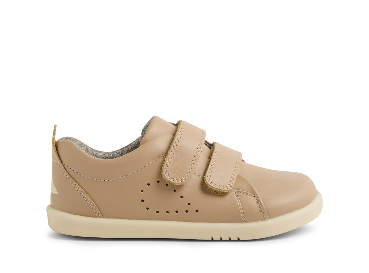 A pair of  unisex casual shoes by Bobux, style Grass Court, in taupe leather with double velcro fastening. Right side view.
