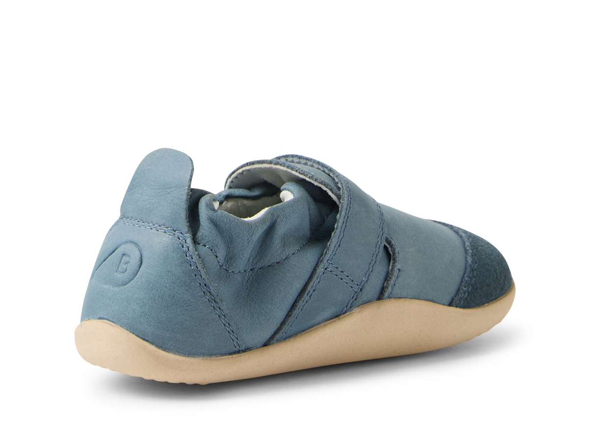 A unisex pre walker by Bobux ,style Marvel XP, in blue with velcro fastening. Angled left side view.