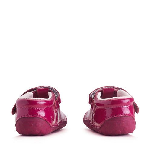 A girls T-bar pre walker by Start-Rite, Style Tumble, with star design and toe bumper, in red with velcro fastening. Back view of a pair.