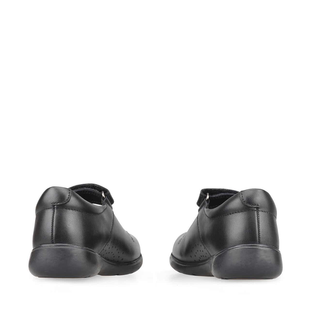 A pair of girls Mary Jane school shoes by Start Rite, style Wish, in black leather with flower motif and velcro fastening. View from back of shoes.