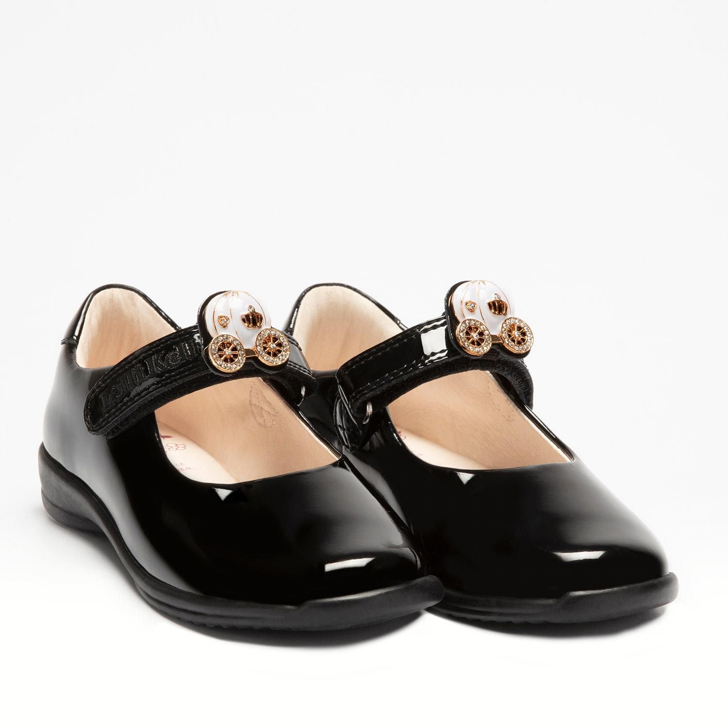 A pair of girls Mary Jane school shoes by Lelli Kelly, style LK8119 Ella, in black patent leather with velcro fastening and detachable gold/white pumpkin carriage. Angled view.