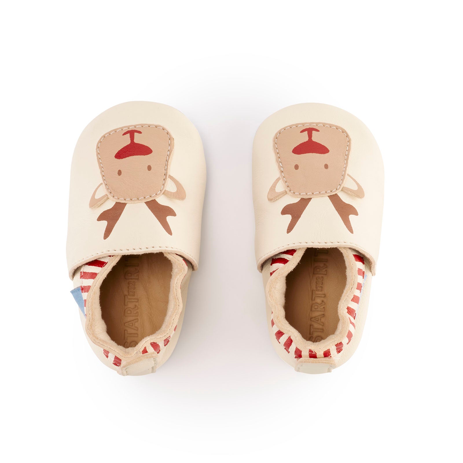 A unisex pram shoe by Start-Rite , style Fable , A slip on Cream and Red Leather Reindeer shoe. Top view of a pair.