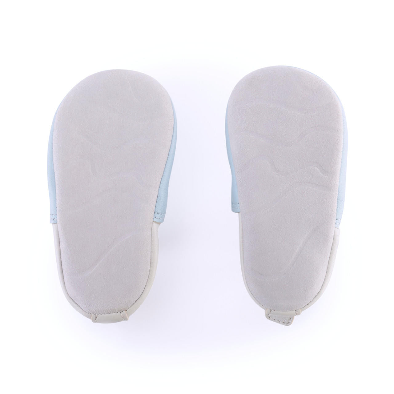 A unisex pram shoe by Start-Rite. Style is fable, a pull on in pale blue leather. Bottom view.