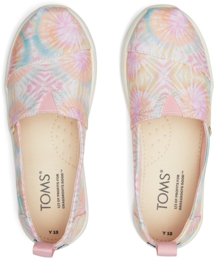 A girls canvas shoe by TOMS, style Alpargata, a slip on in Candy Pink Tie Dye. Top view of a pair.