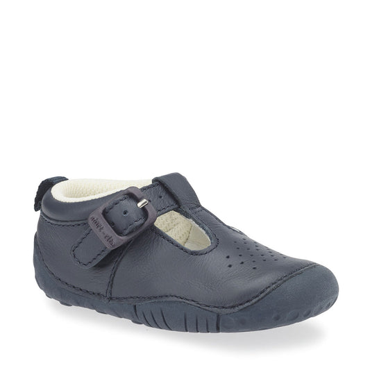 A boys T-Bar shoe by Start-Rite, style Baby Jack, in navy leather with punch out detail and buckle fastening. Right side view.