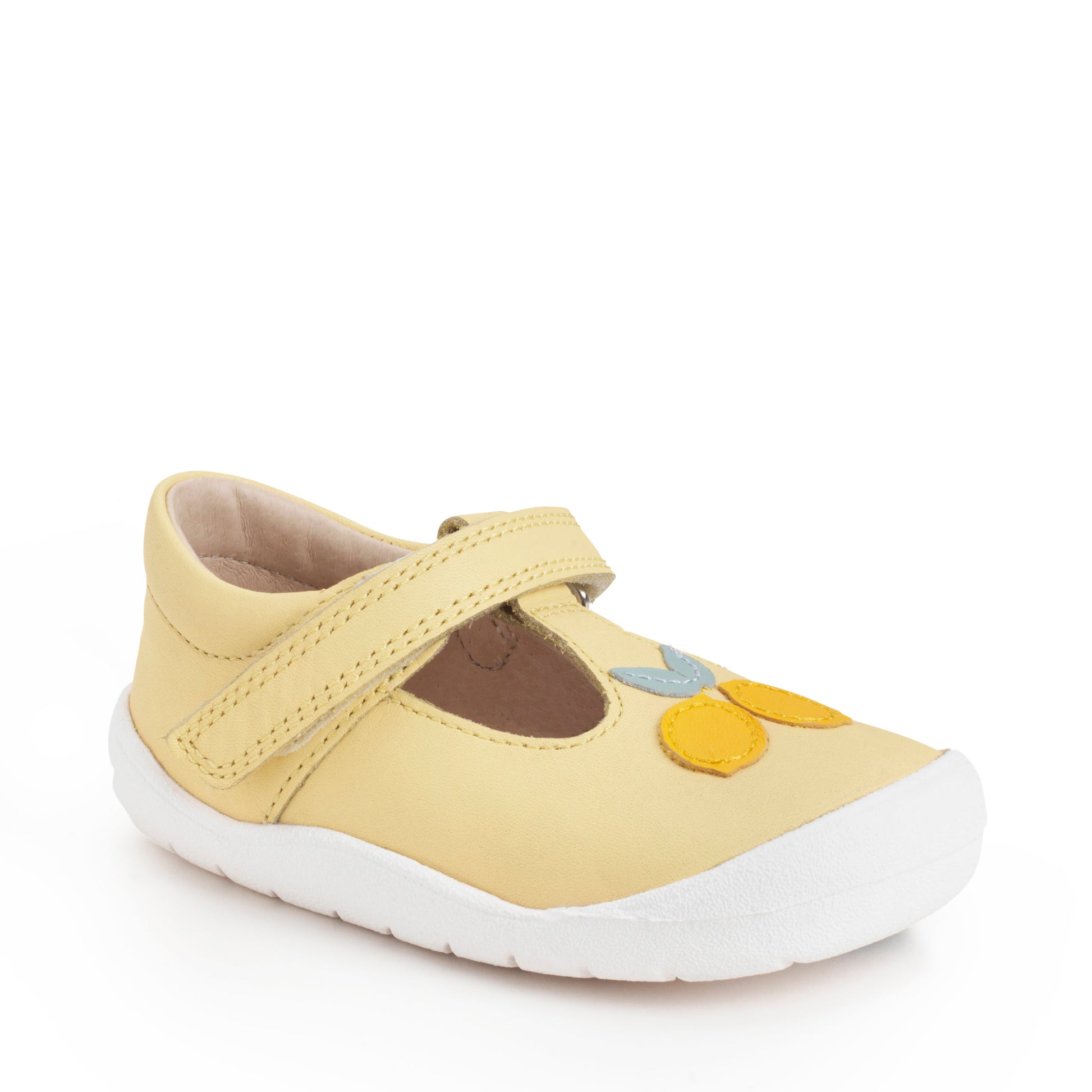 A girls T-Bar shoe by Start Rite + JoJo Maman Bebe ,style Squeeze, in lemon yellow leather with velcro fastening. Angled view.