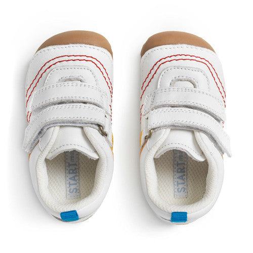 A boys pre-walker by Start-Rite, style Little Smile, white leather double velcro with red stitch detail and blue heel tab. Top view of a pair.