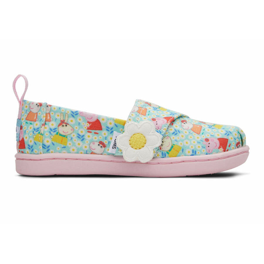 A girls canvas shoe by TOMS, style Alpargata Peppa Pig, in light jade Peppa Pig print, and a velcro strap with daisy detail. Right side view.
