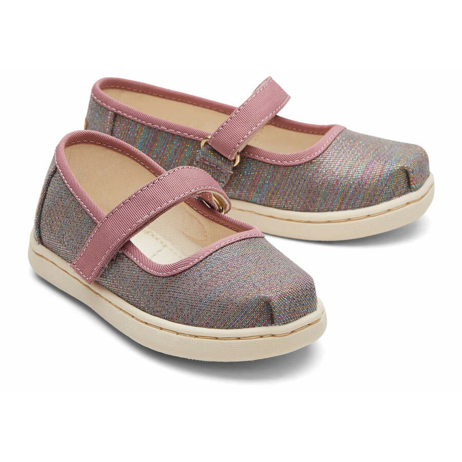 A girls canvas shoe by TOMS, style Mary Jane, in Raspberry multi twill glimmer, wit a velcro strap.Front view of a pair.