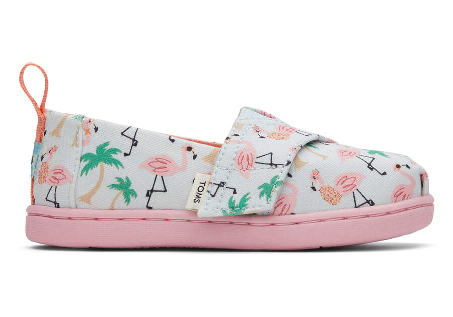 A girls canvas shoe by TOMS, style Alpargata Flamingo, in soft blue Flamingo print with velcro fastening. Right side view.