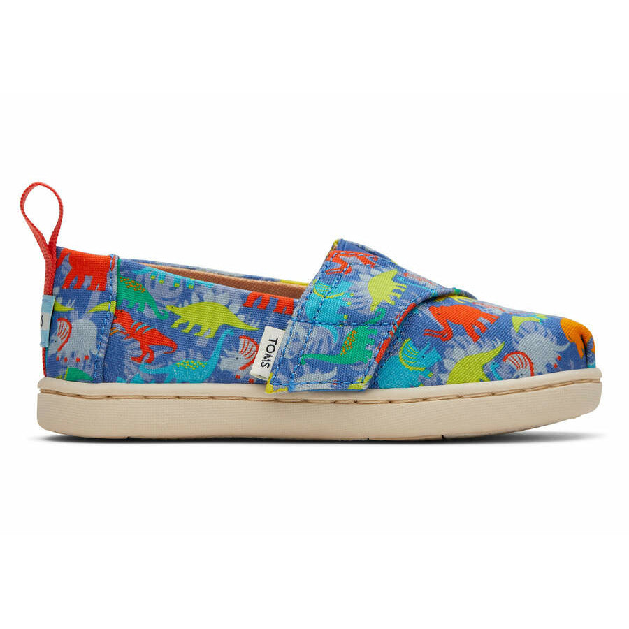 A boys canvas shoe by Toms, style Alpargata Dinos, in dinosaur print with velcro fastening. Right side view.