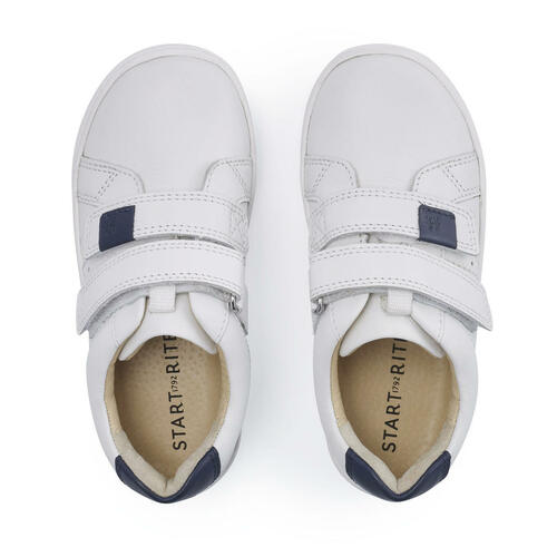 A pair of boys casual shoes by Start Rite, style Explore, in white and navy leather with double velcro fastening. Top view.