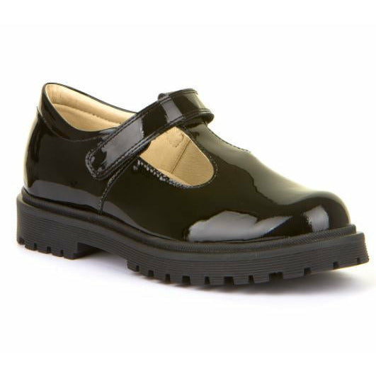 A girls T-Bar school shoe by Froddo, style Lea T, in black patent with velcro fastening. Angled view.