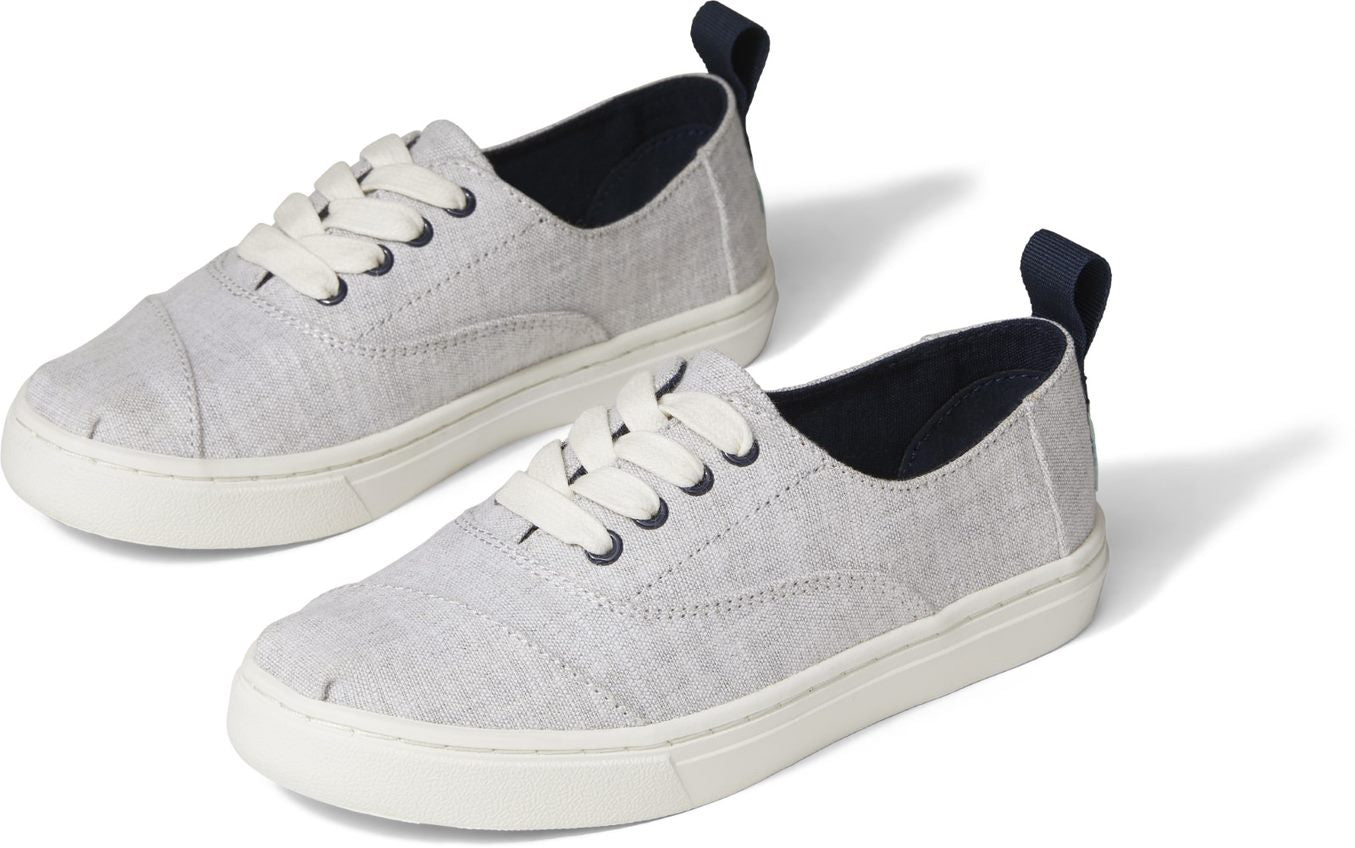A unisex canvas shoe by TOMS , style Cordones Cupsole, a lace up in grey. Front and side view of a pair.