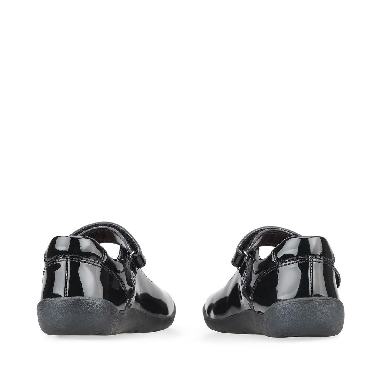 A pair of girls Mary Jane school shoe by Start Rite, style Giggle, in black patent with velcro fastening. Back view.