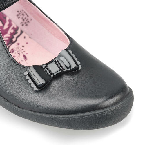 A girls Mary Jane school shoe by Start Rite, style Giggle, in black leather with velcro fastening. Close up of bow.