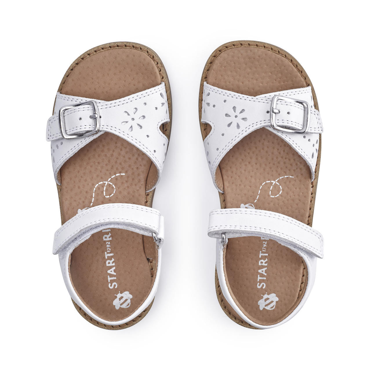 A pair of girls open toe sandals by Start Rite, style Holiday in white leather with Velcro fastening. Above view.