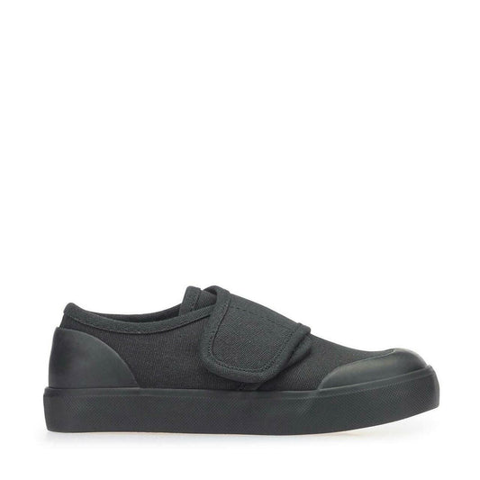 A unisex canvas school pump by Start Rite, style Skip ,in black with single velcro fastening. Right side view.
