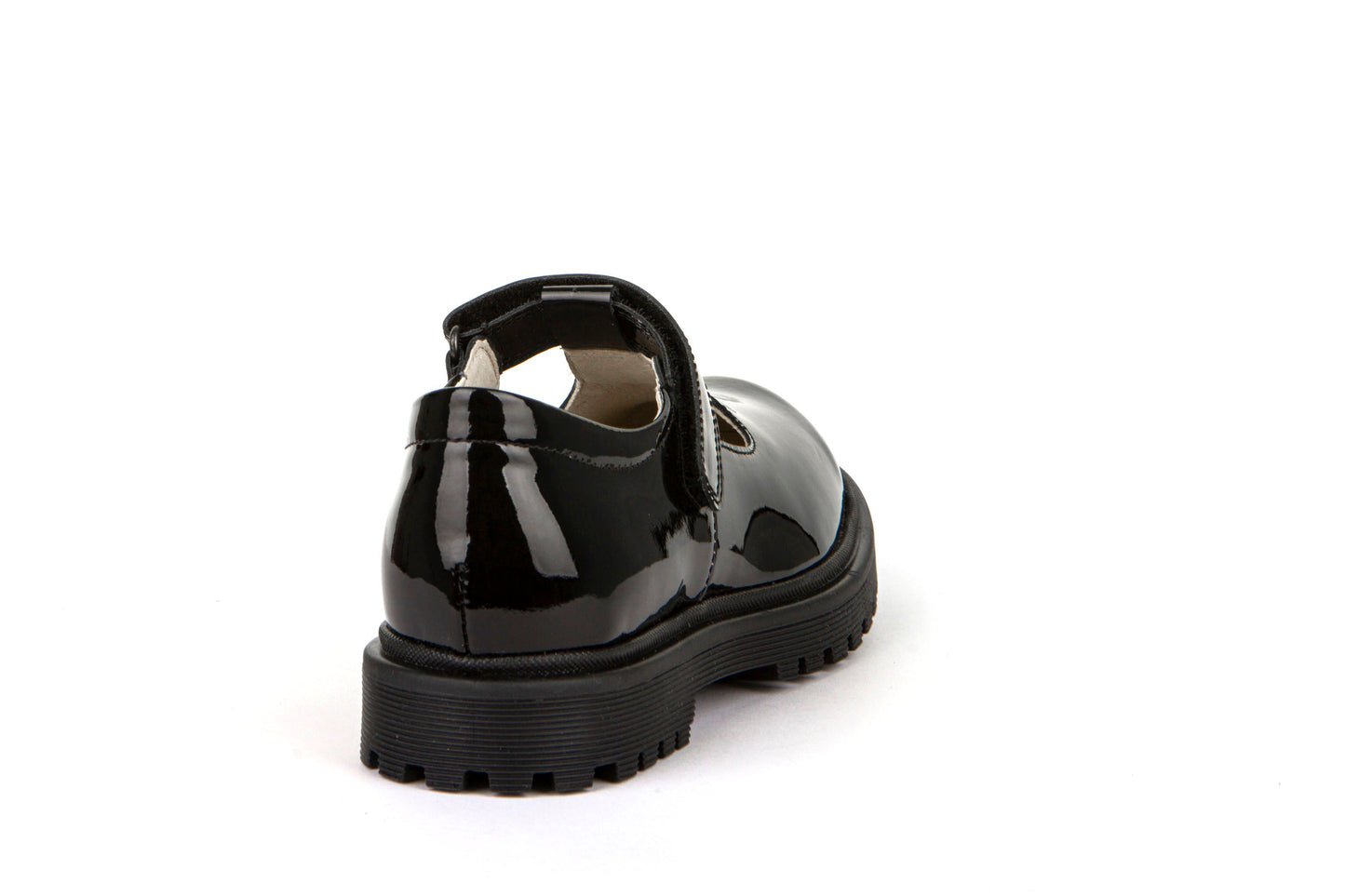 A girls T-Bar school shoe by Froddo, style Lea T, in black patent with velcro fastening. Back view.