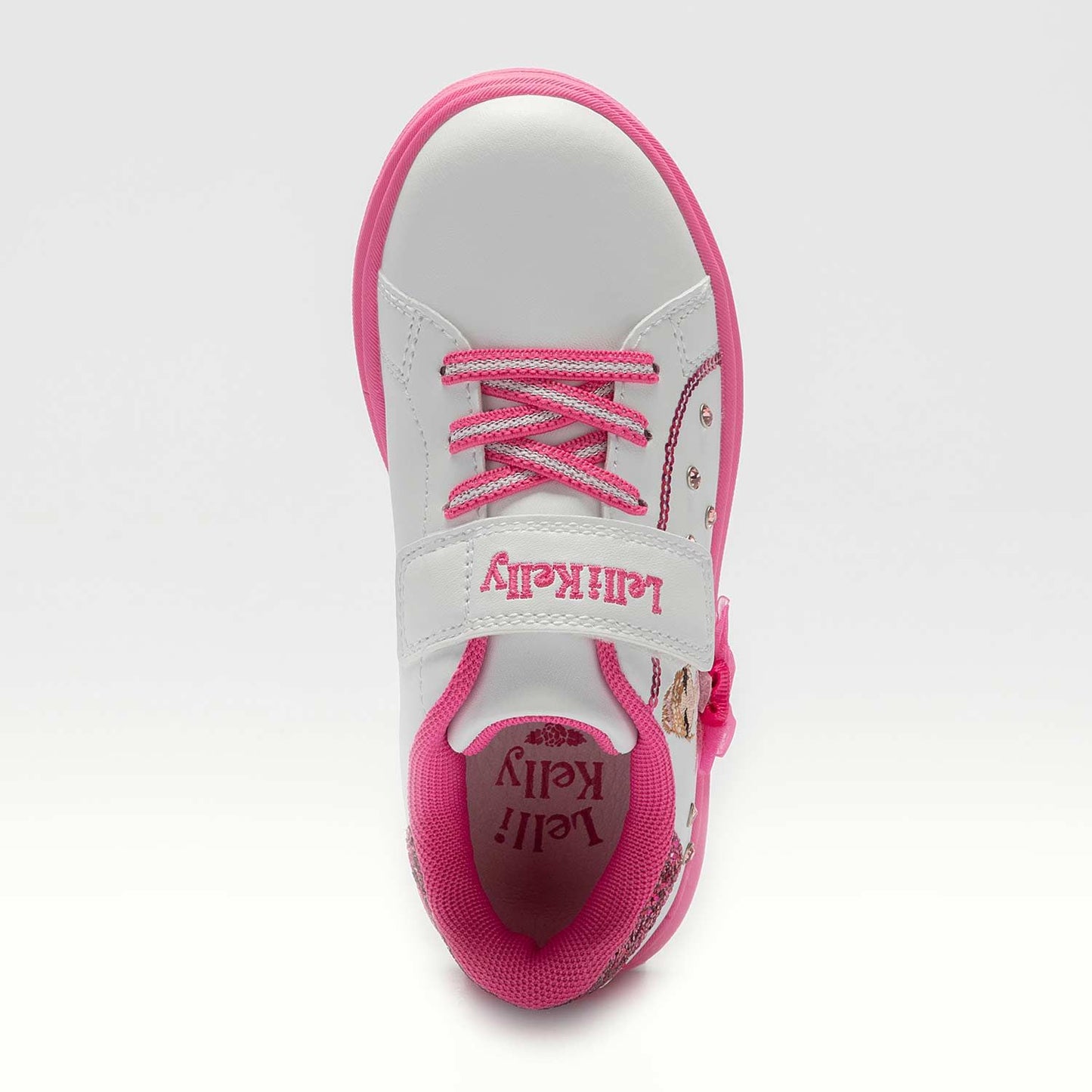 A girls casual trainer by Lelli Kelly, style Mille Stelle, in white and pink with velcro fastening. Above view.