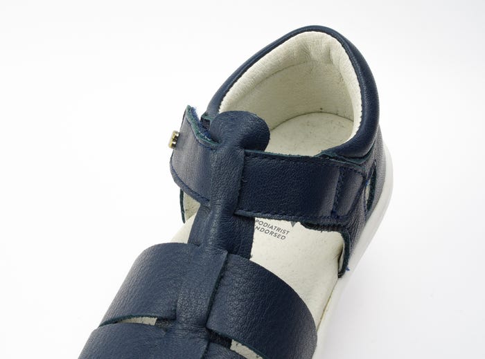 A boys closed toe sandal by Bobux, style Tidal ,in Navy with velcro fastening. Above view.