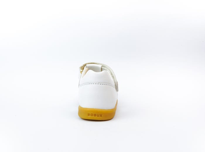 A closed toe strappy sandal by Bobux, style cross jump, in white with velcro fastening. Back view.