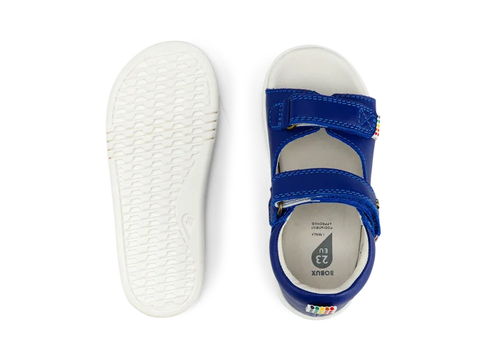 A boys open toe sandal by Bobux, style Rise in Blue leather with velcro fastening. view of sole and top of sandal from above.