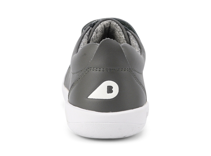 A boys casual trainer by Bobux, style Grass Court,in navy with double velcro fastening. Back view.