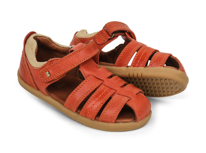 A pair of boys closed toe sandals by Bobux,style Roam,in orange with velcro fastening. Right side view.
