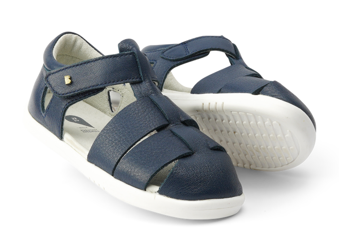 A pair of boys closed toe sandals by Bobux,style Tidal, in Navy with velcro fastening. Right side view.