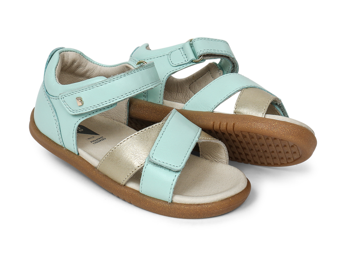 A pair of girls open toe sandals by Bobux, style Sail, in mint and gold with velcro fastening. Right side view.