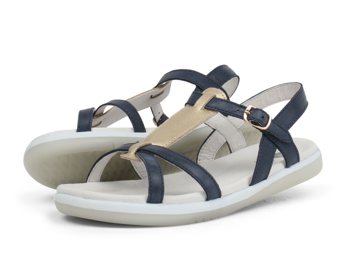 A pair of girls open toe sandals by Bobux, style Pixie, in navy and gold with buckle fastening. Left  side view.
