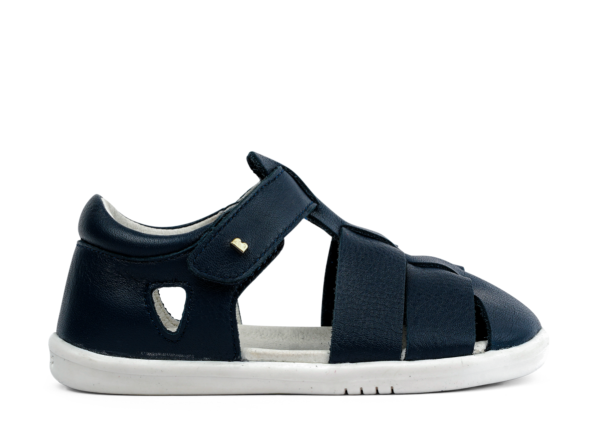 A boys closed toe sandal by Bobux,style Tidal, in Navy with velcro fastening. Right side view.